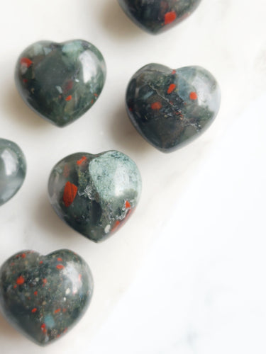 African Bloodstone, rich in spiritual energy, aids physical healing and strength. Its earthy hue, speckled with red, symbolizes vitality, courage, and purpose. This sacred stone enhances intuition, fosters spiritual growth, and boosts physical resilience