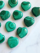 Load image into Gallery viewer, Unlock the transformative power of Malachite. This protective crystal enhances spiritual growth and psychic abilities while dispelling negativity. Embrace inner strength and amplify your intentions with Malachite
