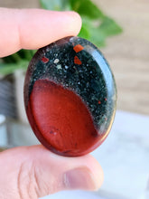Load image into Gallery viewer, African Bloodstone embodies both spiritual power and physical strength, with its vibrant green hue representing vitality and passion. This sacred stone enhances intuition and fosters spiritual growth while supporting physical healing and resilience
