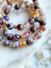 Load image into Gallery viewer, Agate&#39;s captivating swirls and bands harmonize energies, promoting balance and tranquility. Embrace its calming presence in meditation, letting its gentle vibrations cleanse your mind and spirit, leading you to inner peace. Each agate piece showcases Earth&#39;s artistic prowess, offering not only beauty but also a connection to higher spiritual realms
