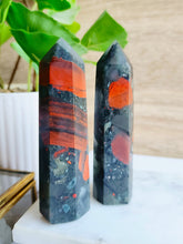 Load image into Gallery viewer, African Bloodstone embodies both spiritual power and physical strength, with its vibrant green hue representing vitality and passion. This sacred stone enhances intuition and fosters spiritual growth while supporting physical healing and resilience
