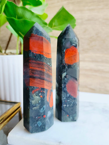 African Bloodstone embodies both spiritual power and physical strength, with its vibrant green hue representing vitality and passion. This sacred stone enhances intuition and fosters spiritual growth while supporting physical healing and resilience