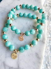Load image into Gallery viewer, Amazonite calms worry and restores balance, offering support for those seeking harmony in both personal and professional realms. With its roots deep in nature, it encourages you to embrace your true self and stand firm in your belief
