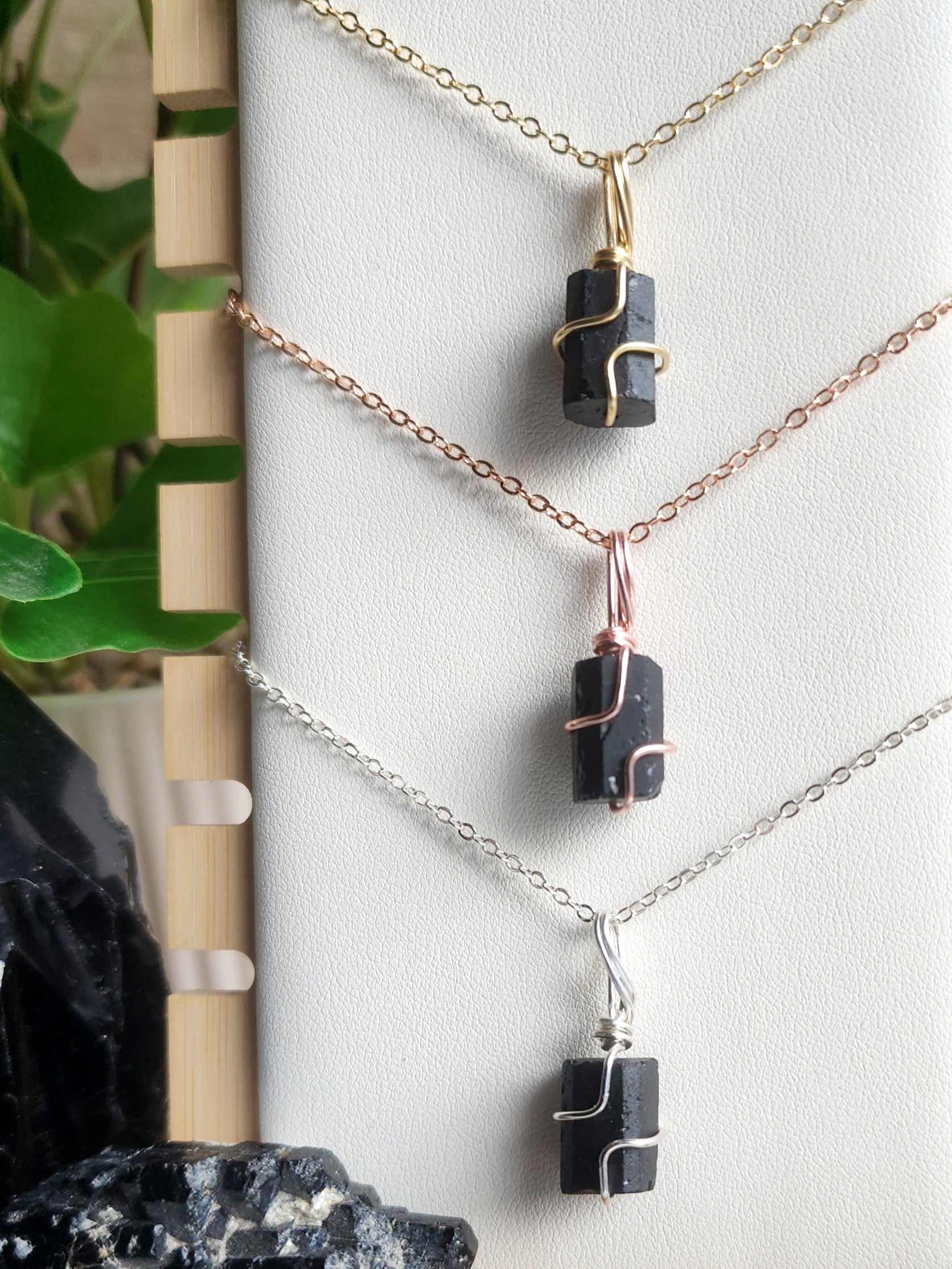 Handcrafted Black Tourmaline crystal necklace by Anay Crystals, featuring a minimalist wire-wrapped setting designed for everyday wear