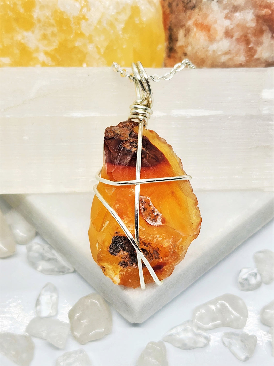 Carnelian is believed to enhance creativity, courage, and passion while also promoting a strong connection to one's inner self and spiritual growth