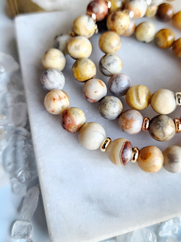 Crazy Lace Agate boosts confidence, positivity, and motivation. Elevate your spirits with its empowering energy