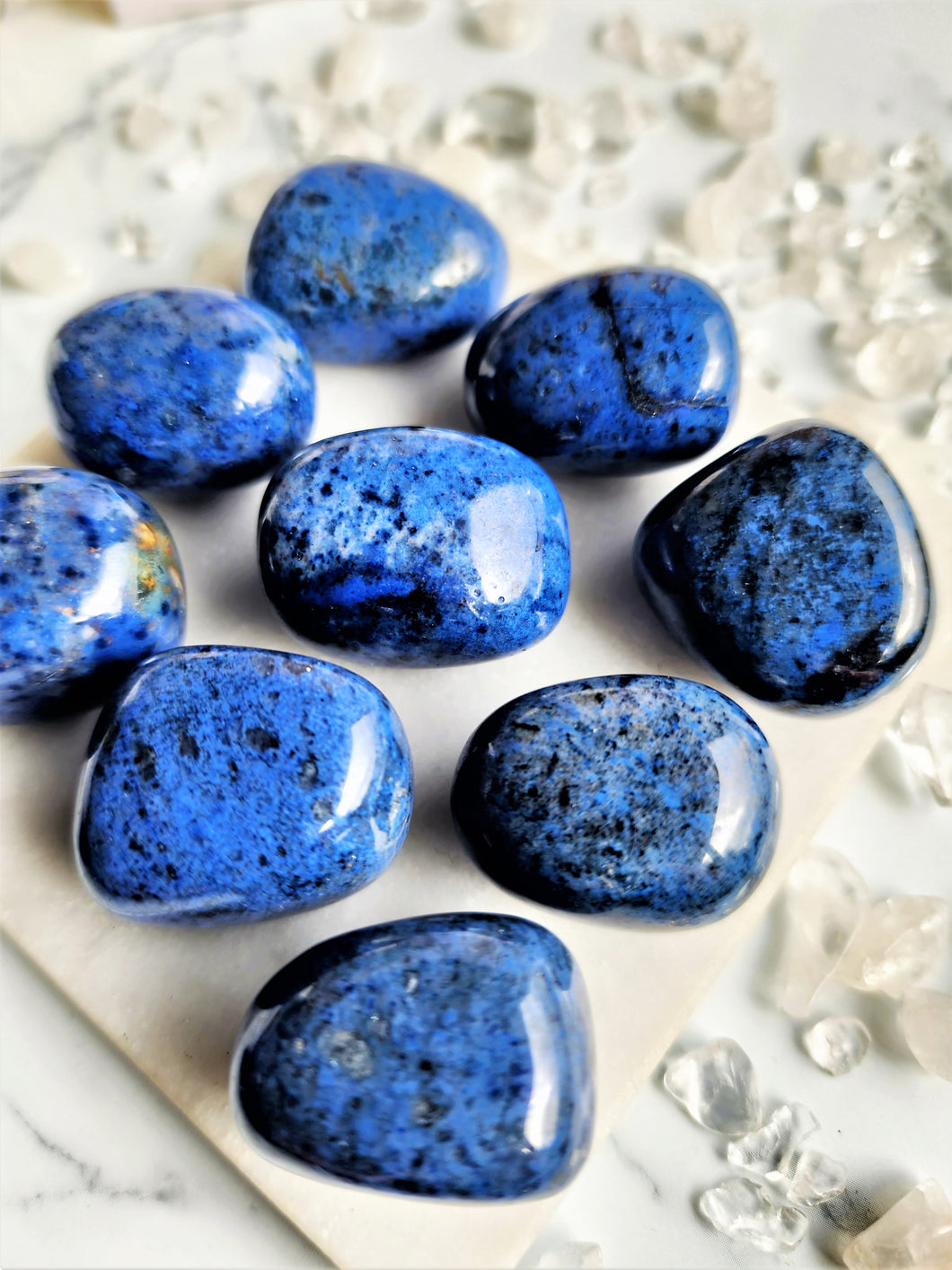 Dumortierite is believed to possess strong spiritual properties, promoting a sense of calmness and clarity within the mind. It is thought to aid in enhancing one's psychic abilities and opening channels of communication with higher realms