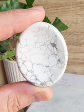 Load image into Gallery viewer, Howlite, a stone of patience and peace, encourages letting go of negativity and prioritizing self-care. Its calming properties support composure under pressure and foster confident self-expression, making it an excellent crystal for a peaceful night&#39;s sleep.
