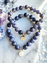 Load image into Gallery viewer, Known as the &quot;Stone of Vision,&quot; Iolite empowers you to embrace new perspectives and awaken your inner wisdom. This crystal fosters personal growth and spiritual awareness, leading you toward greater purpose and understanding
