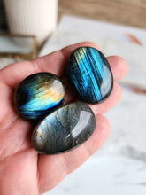 Load image into Gallery viewer, With its iridescent hues reminiscent of the northern lights, labradorite is believed to possess a powerful energy that aids manifestation and personal transformation.

