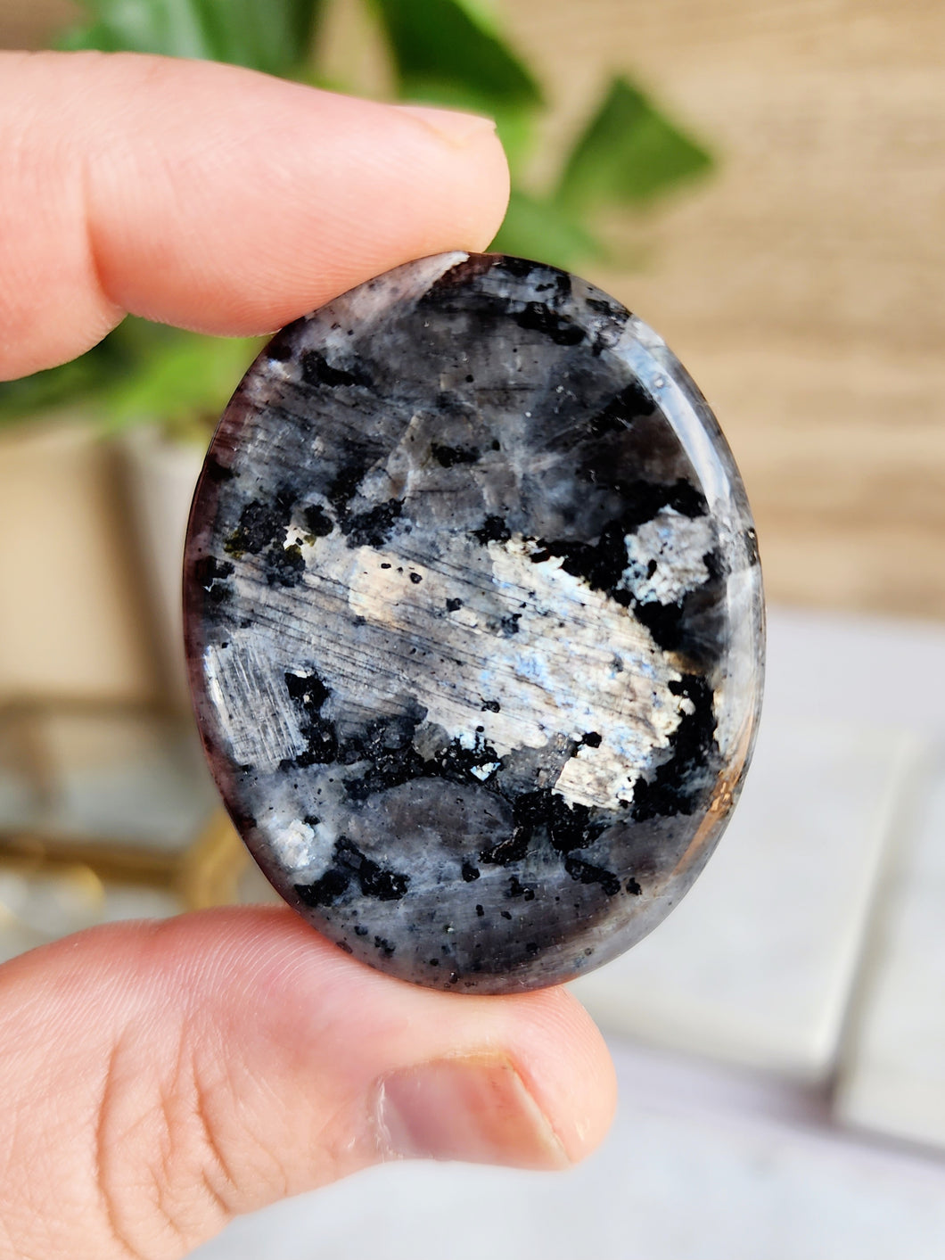 Larvikite's captivating colors and iridescent sheen enhance any space, promoting relaxation and a soothing ambiance. This mystical stone removes negative energy, fostering self-discovery and personal growth