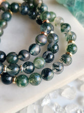 Load image into Gallery viewer, Moss Agate, a stone of new beginnings, attracts wealth and opportunities while fostering forgiveness and personal growth. Its calming energies ensure emotional balance, providing steadfast support during moments of uncertainty
