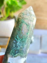 Load image into Gallery viewer, Explore Moss Agate: a stone of new beginnings and wealth. Its calming energy encourages growth and forgiveness, providing comfort during uncertainty. Embrace its soothing presence for emotional balance and endless opportunities
