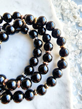 Load image into Gallery viewer, Known for its purifying and protective qualities, Black Obsidian anchors you to the earth and clears negative energies, creating a secure and harmonious space
