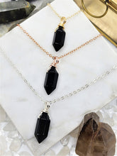 Load image into Gallery viewer, Obsidian is revered for its spiritual properties, known to provide protection against negativity, facilitate self-reflection, and reveal hidden truths
