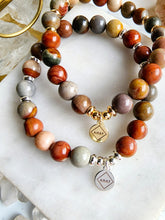Load image into Gallery viewer, Discover balance and creativity with Polychrome Jasper. This enchanting stone uplifts your spirit, inspiring positivity and self-discovery. Perfect for meditation, embrace its captivating influence on your spiritual journey.
