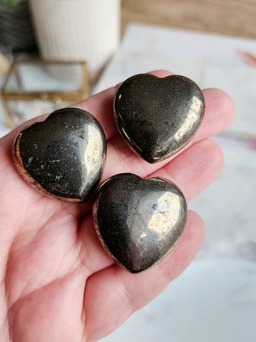 Pyrite serves as a potent symbol of abundance and confidence, guiding you towards success. Let it light your way, empowering your journey and opening doors to new opportunities. Embrace Pyrite's essence of achievement, and witness it become your steadfast companion on the road to fulfillment