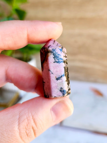 Embrace Rhodonite's healing power for love, empathy, and spiritual growth. Experience transformative journeys with this gemstone
