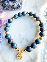 Load image into Gallery viewer, The dynamic pairing of Ruby and Kyanite supports emotional healing, spiritual growth, and personal empowerment. Together, they clear blockages and guide you toward your highest potential
