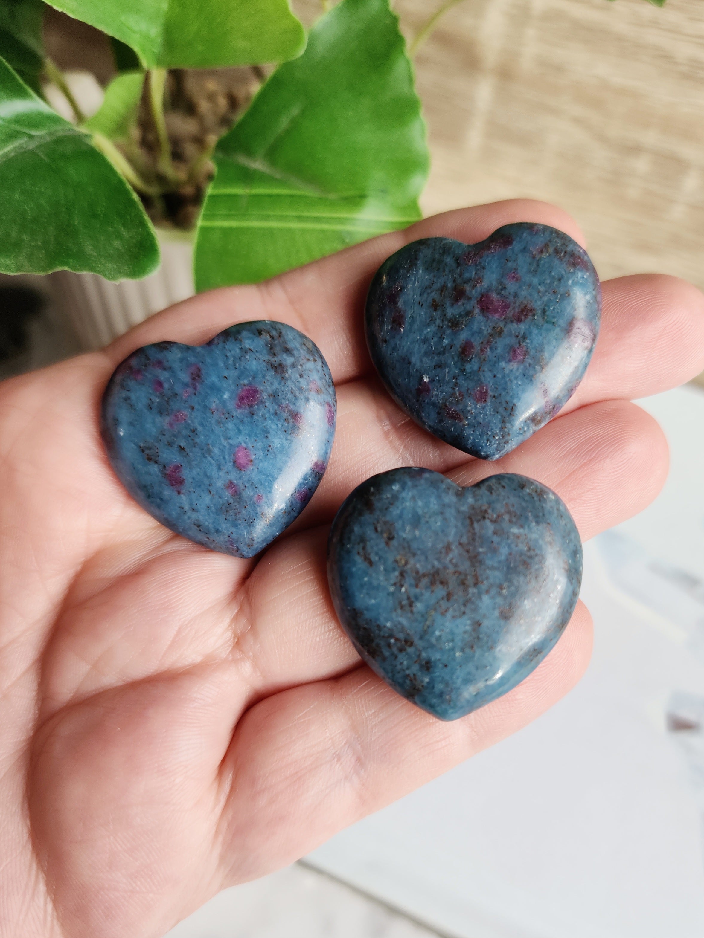 Carved Ruby in Kyanite crystal heart featuring natural red Ruby within blue Kyanite.