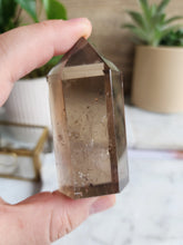 Load image into Gallery viewer, With its earthy vibrations, Smoky Quartz shields against stress and encourages a sense of tranquillity. This stone helps release old patterns, enhancing clarity and deepening your connection to the Earth
