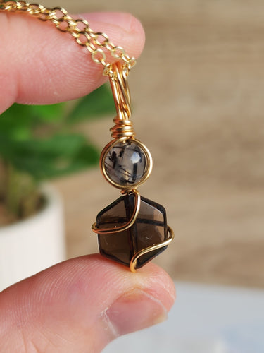 Feel grounded and protected with Smokey Quartz and Tourmaline Quartz. Clears negative energy and supports calm strength in any environment