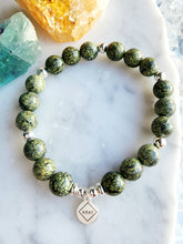 Load image into Gallery viewer, Symbolizing renewal with its serpent-like patterns, Snakeskin Jasper encourages personal growth and emotional resilience. Formed deep within the earth, this stone connects you to grounding and transformative energies
