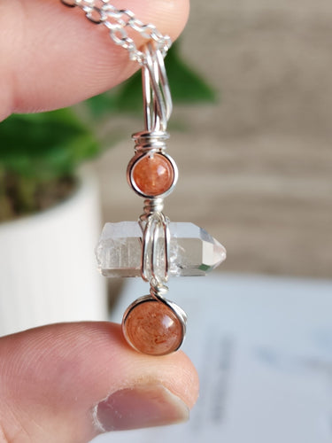 Crystal necklace for creativity and confidence with Sunstone and Clear Quartz. Boosts joy, clarity, motivation, and self-expression.