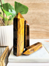 Load image into Gallery viewer, Tigers eye is full of motivating energy that keeps you focused on your goals. Its protective properties keep unwelcome energy away

