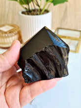 Load image into Gallery viewer, Black Obsidian is a cleansing crystal that shields against negative energy while keeping you grounded and promoting a calm space.

